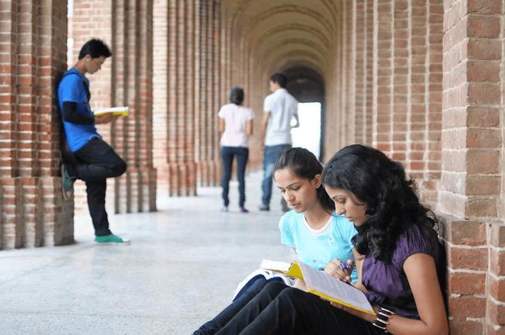 Indian college students on a university campus, representing how the Central Sector Scheme of Scholarship supports higher education dreams (higher education ke liye scholarship support).
