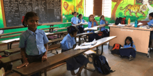 Children studying in an Indian government school classroom, reflecting Samagra Shiksha’s vision of continuous education from anganwadi to Class 12 (समग्र शिक्षा अभियान).