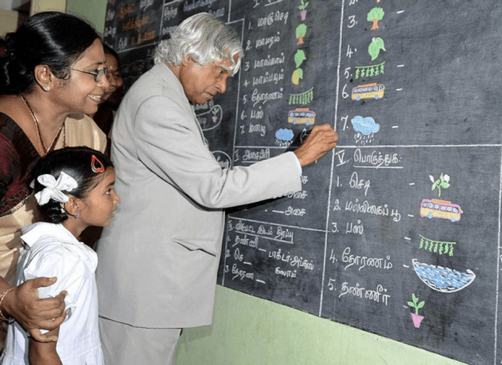 Abdul Kalam interacting with students in a classroom, reflecting his belief that education builds both skill and character.