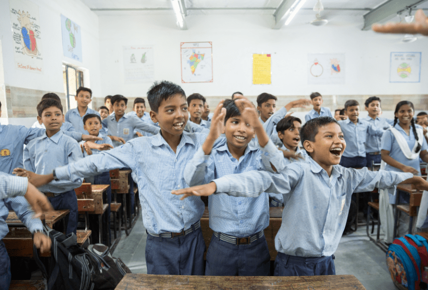 Indian school students pausing together in a morning assembly that builds focus, reflection, and human connection